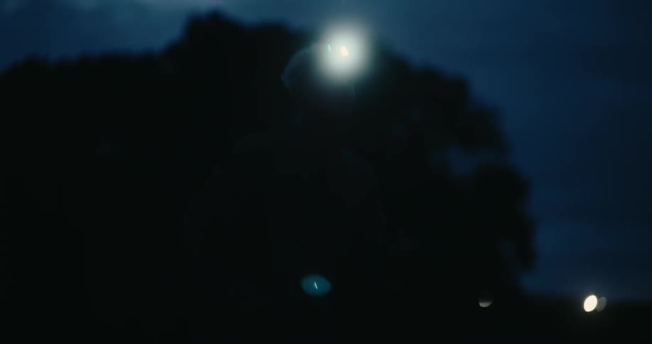 A man is jogging in the dark