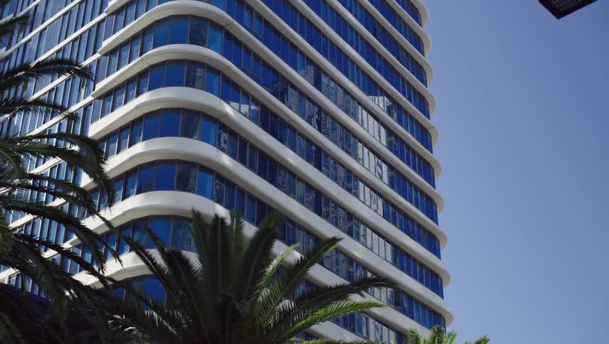 The windows on the side of the building are reflective