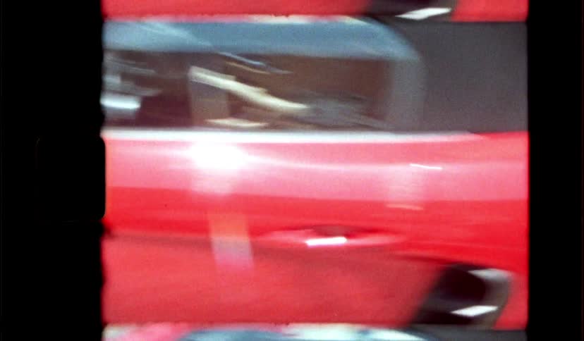 Red sports car on sitting on a road