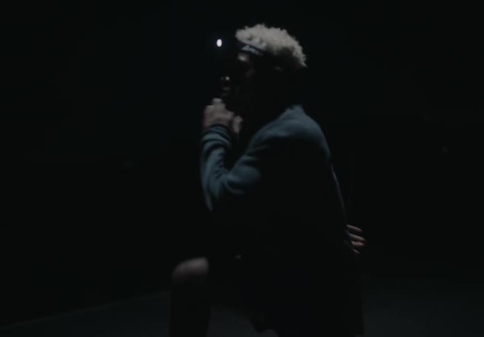A man is running on the road at night