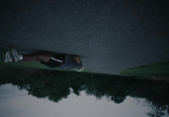 A man stumbles and falls as he runs