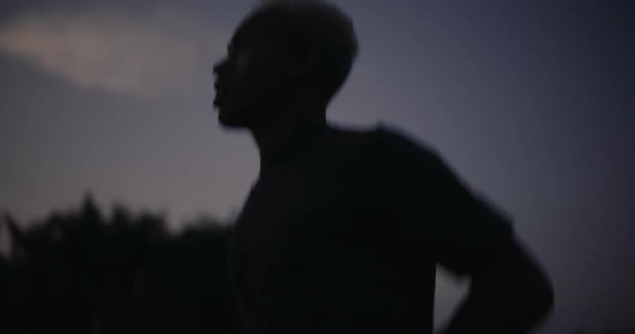 Silhouette of a man jogging in the early morning