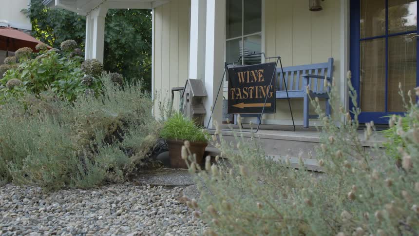 Wine tasting sign on a front porch