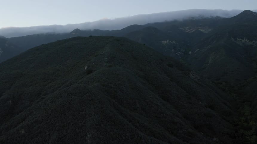 View of misty mountain tops on a cloudy day