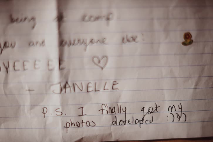 A note is written to someone on paper