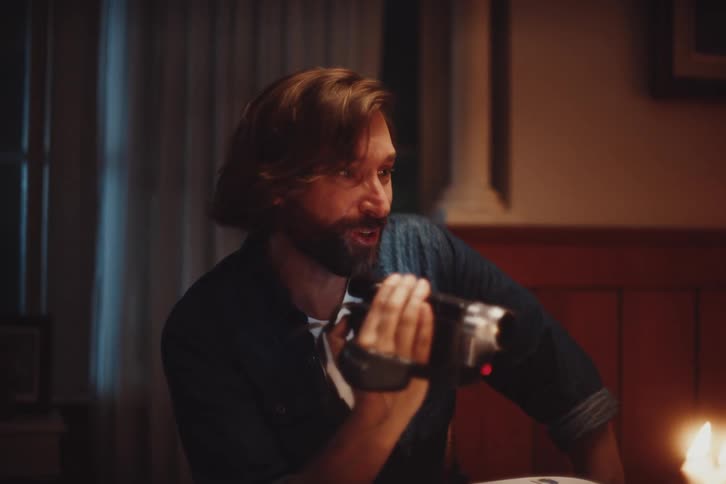 A clip of a man recording on camera