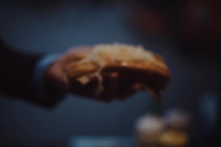 Persons hand holding a snack