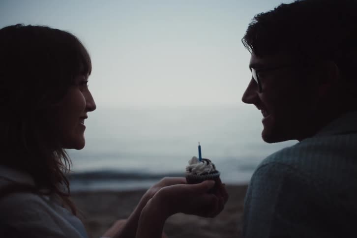 A clip of a man and a woman on the beach