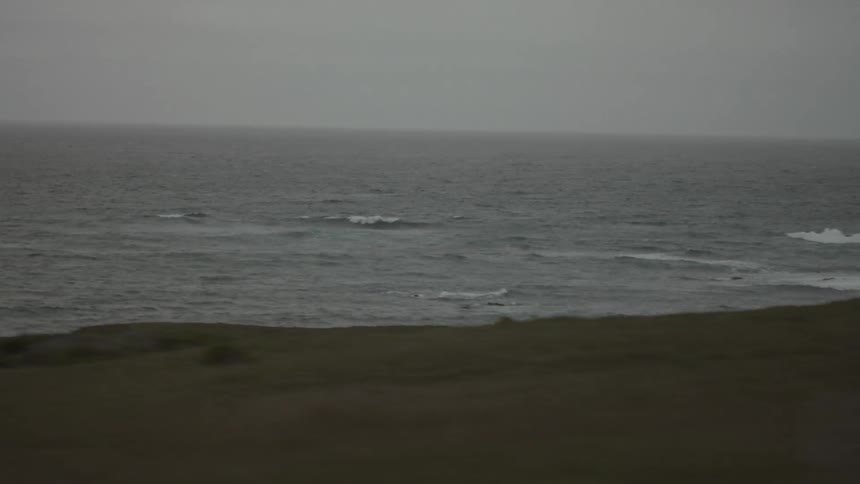 The waves are rough off the coast line