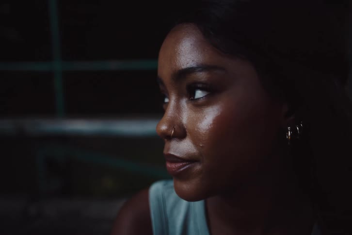 A woman nods and talks
