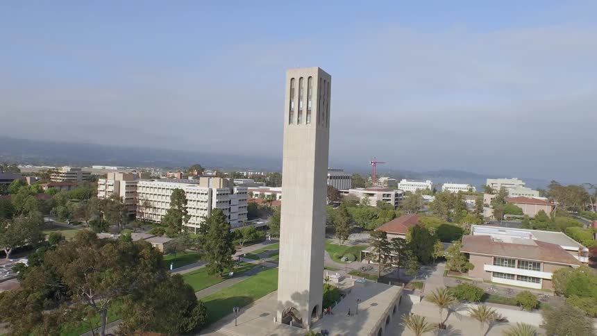 A tall tower monument is standing in a plaza