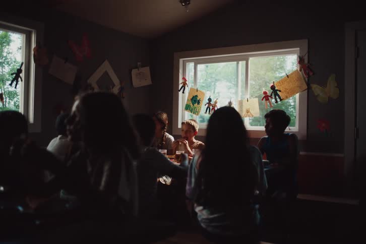 Children eat together and talk