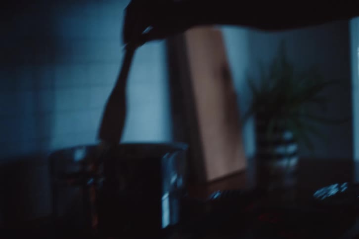Man with a spatula cooking in the kitchen