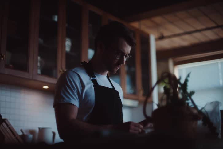 A man is cooking at home