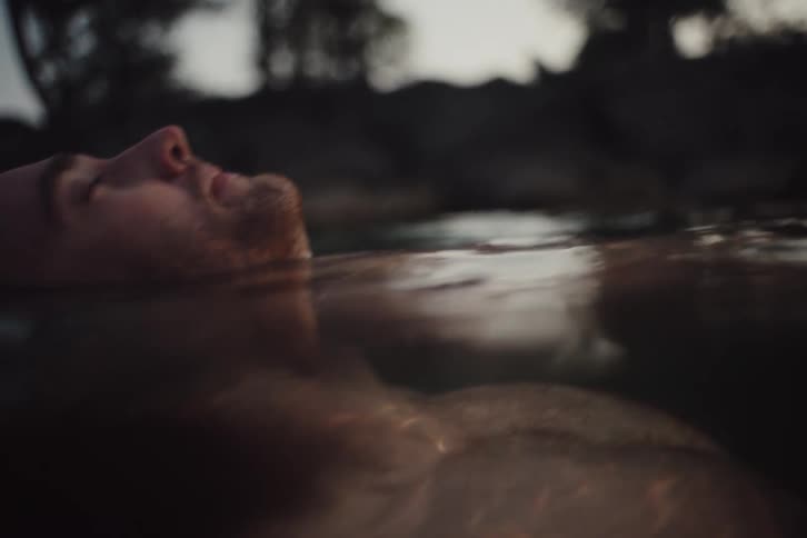 Man floating in water relaxing