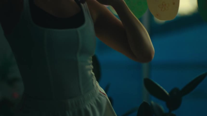 A woman is moving her arms around