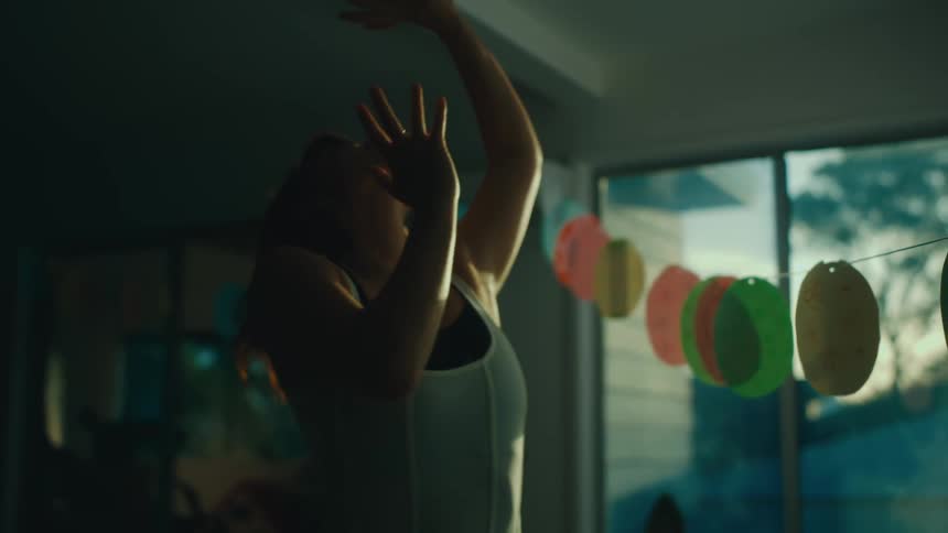 Young woman dancing scenically