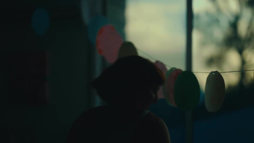 Short haired woman in an indoor space dancing
