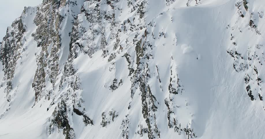 Person skiing down a snowy mountain