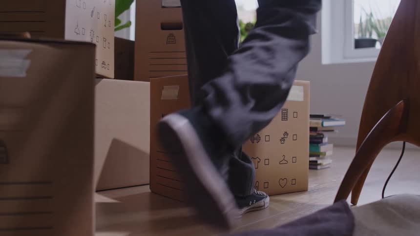 Woman putting objects inside a box