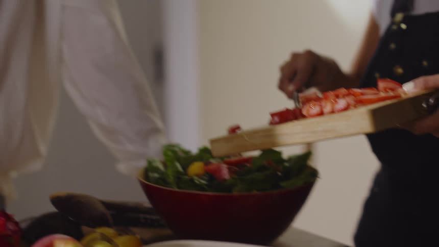 Two women talking and cooking
