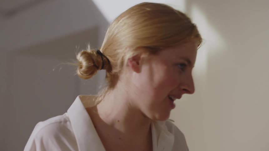 Two women talk together at home