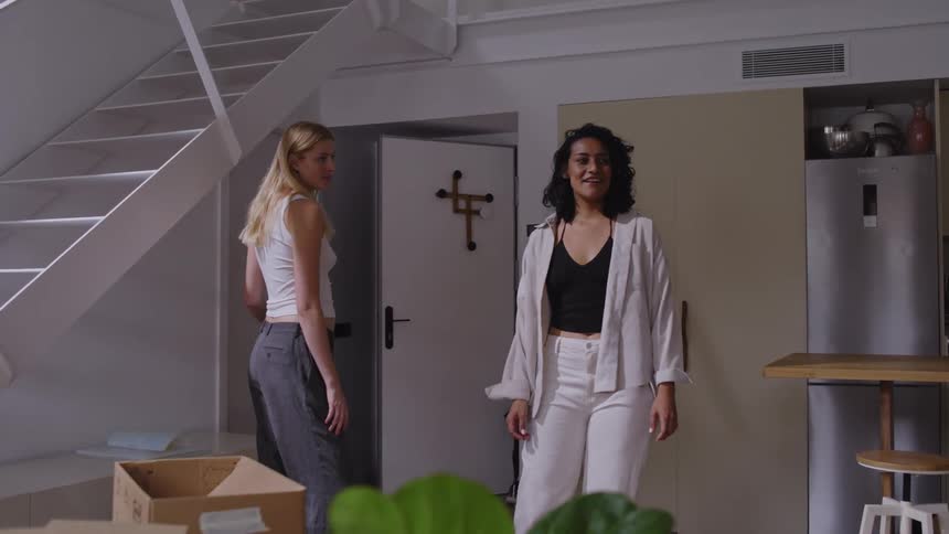 A couple enter the home talking