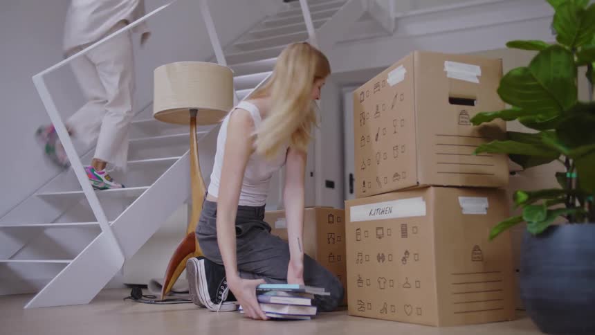 A clip of a lady arraigning her books