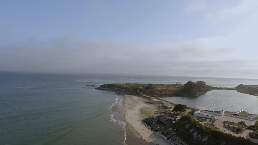 Aerial view of a coastline on a partly cloudy day