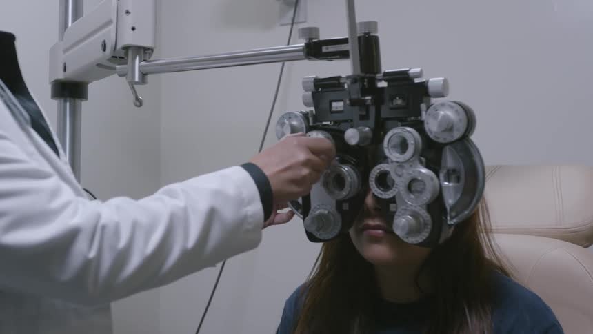 A woman is getting an eye examination