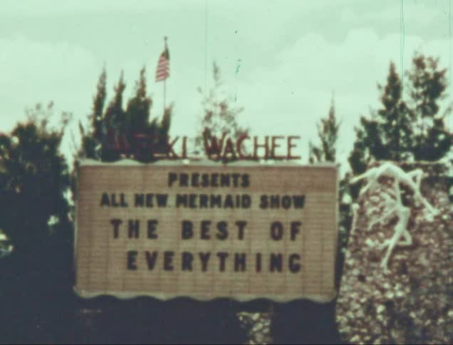 Sign with lettering and a us flag