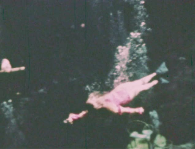 Woman swimming underwater in the ocean