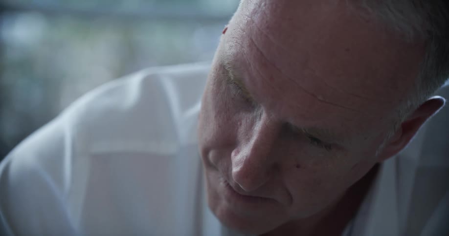 A close up clip of a mans face