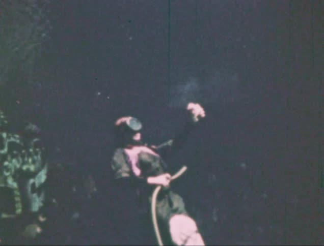 Person in a performance submerged in water