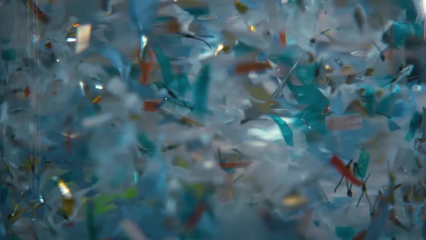 Liquid with abstract colored papers