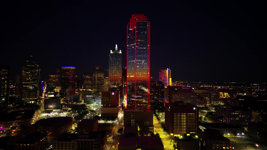 Aerial panorama of skyscrapers and buildings illuminated at night