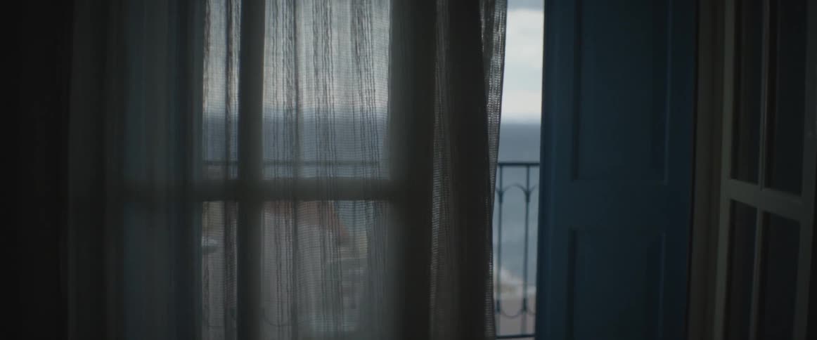 Curtains blowing in the breeze