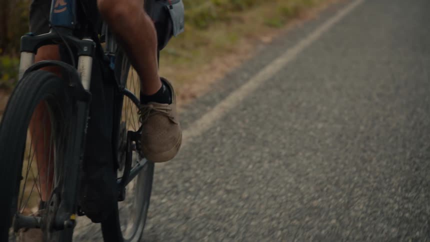 A footage of two people riding a bicycle