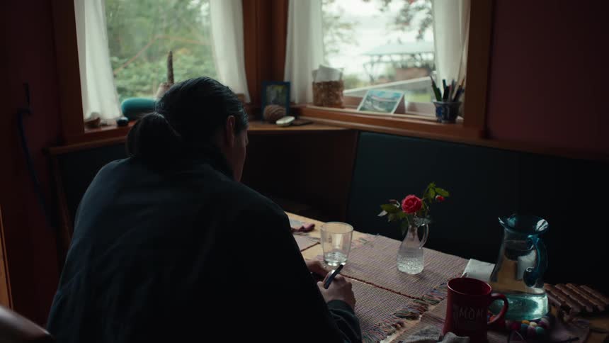 Man sitting at a table and writing