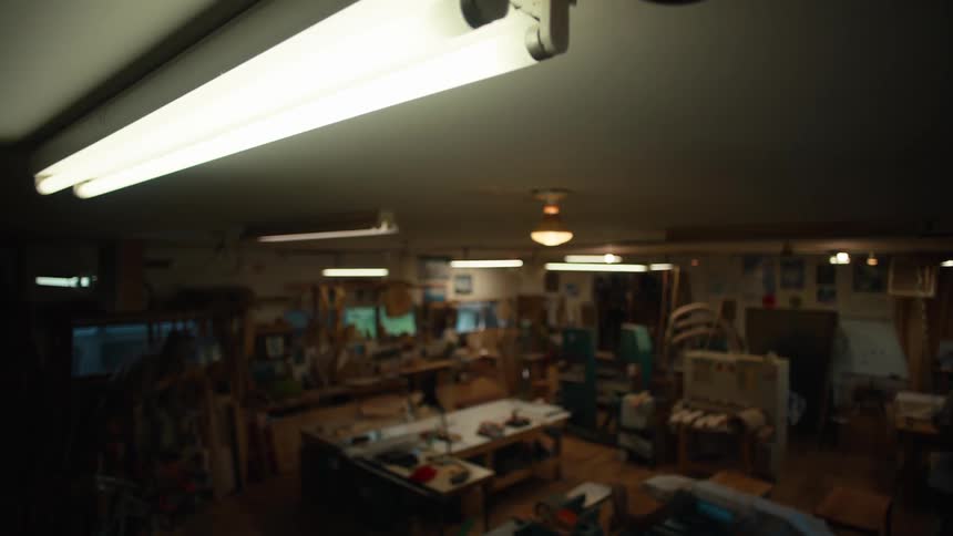 Various lights in a workshop turn off and back on