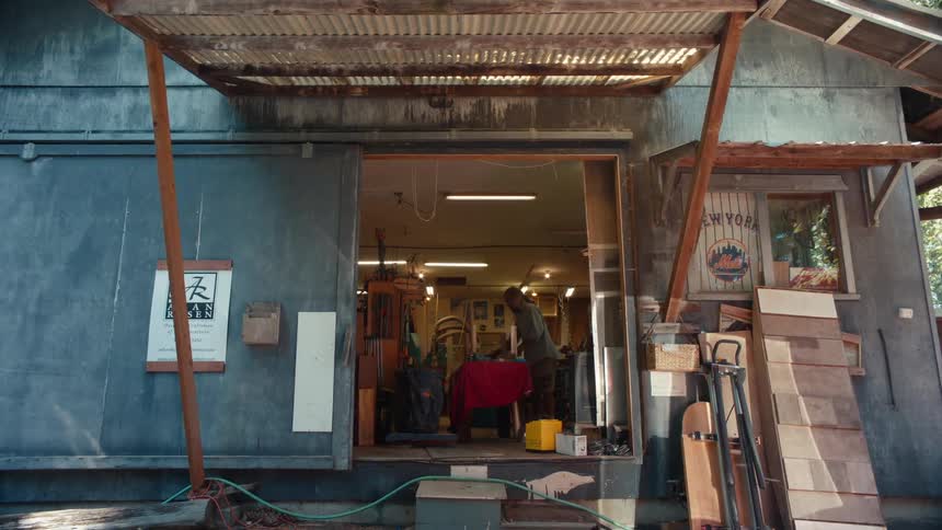 A person is working in the shop with a chair