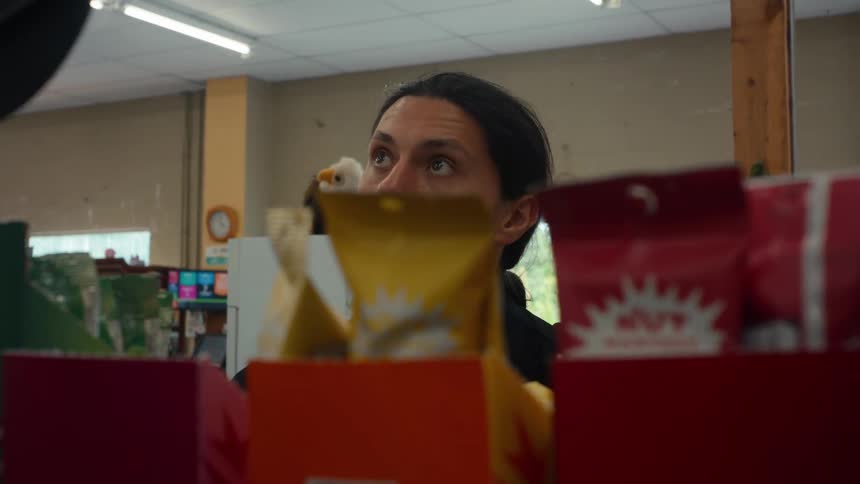 Man in a convenience store during the day