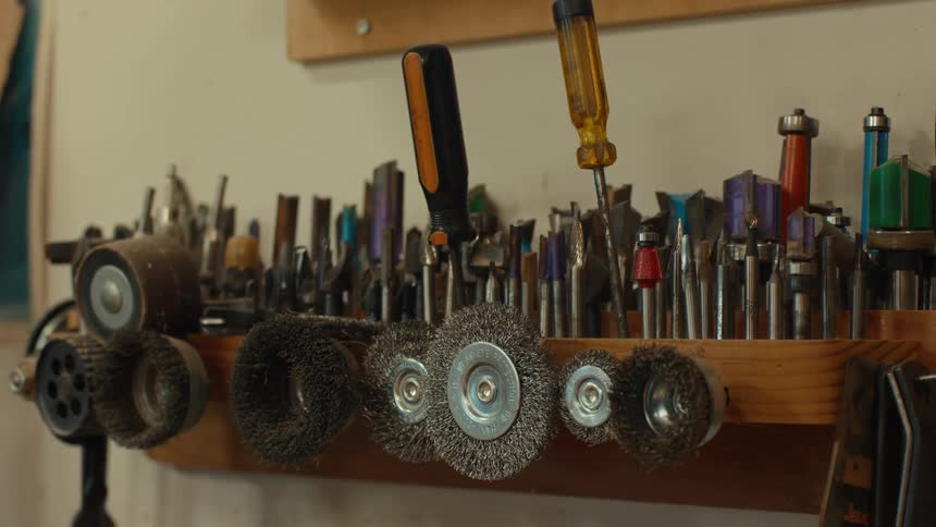 The small bench is full of tools