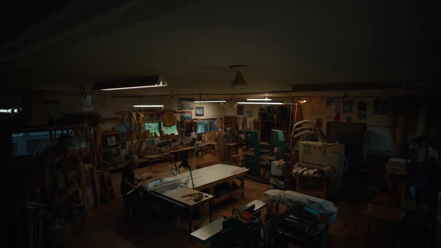 Man working in an indoor space with carpenter equipment