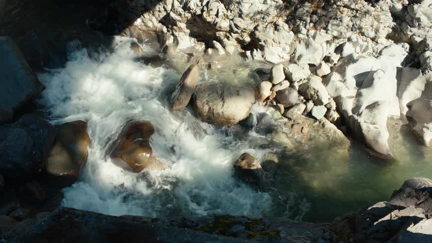 Water rushes past rocks