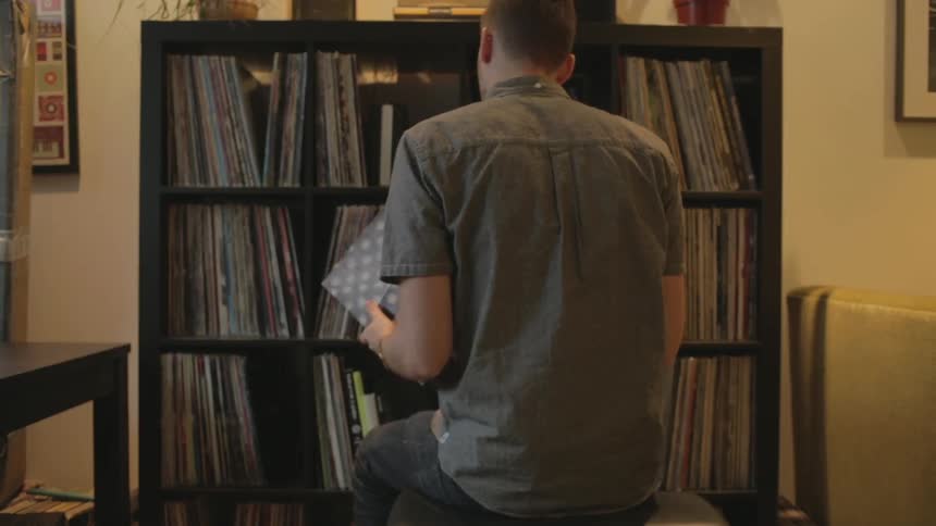 A man looks through shelves of records