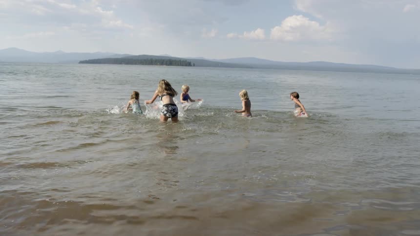Children are playing in the water