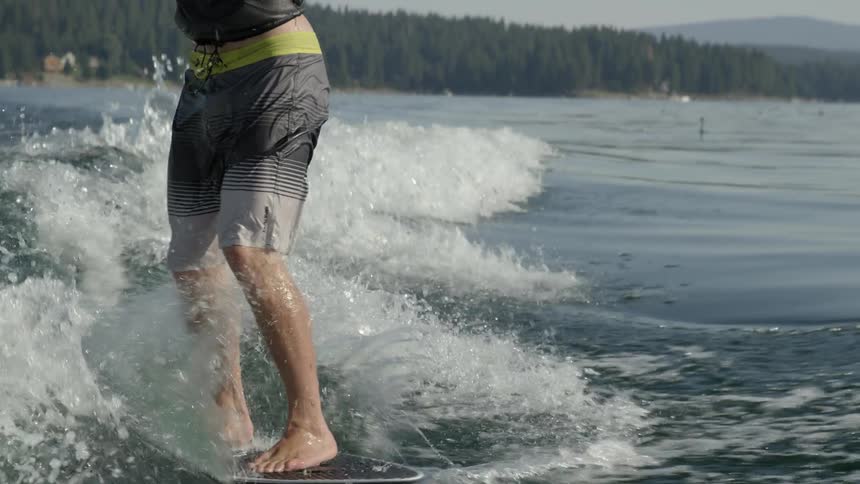 A man wake surfing on lake almanor