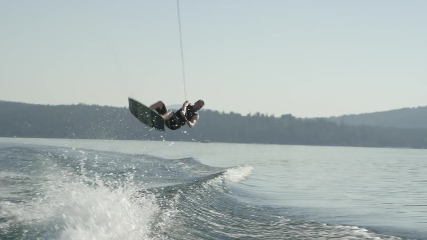 Person does a flip while wakeboarding