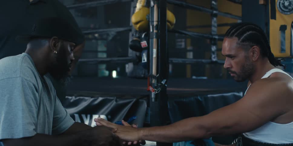 A clip of a person taping a boxers hand